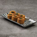 Crispy fried egg tofu on a decorative plate with a gray background