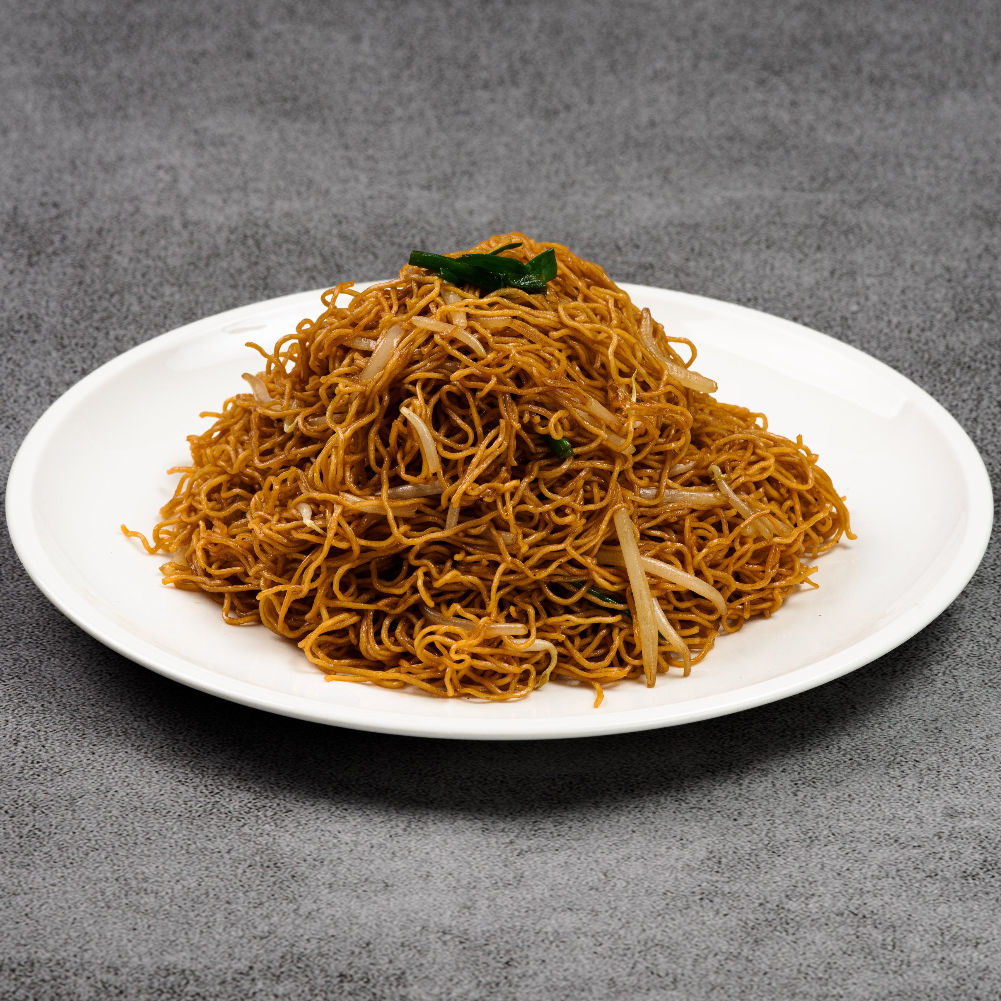 Plate of noodles on a gray background